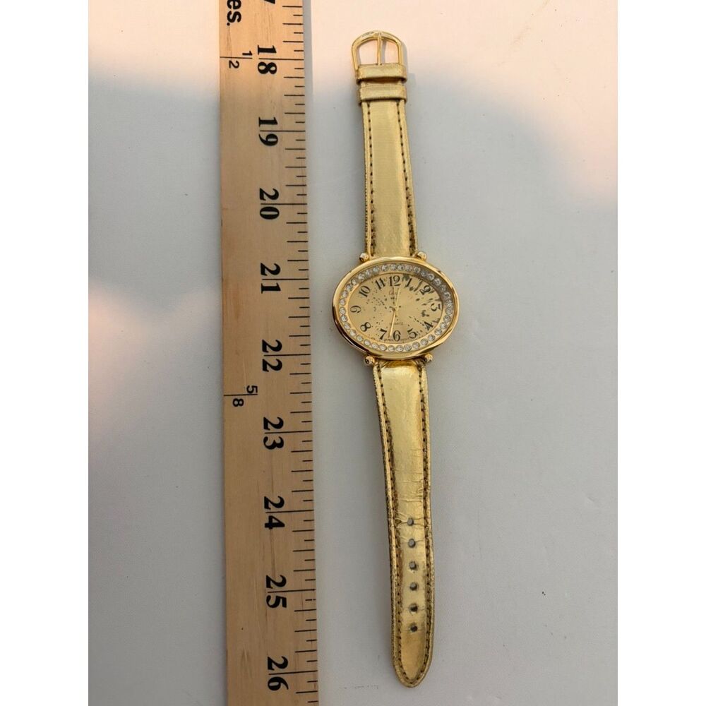 vtg. collezio gold toned quartz watch with crystal bezel